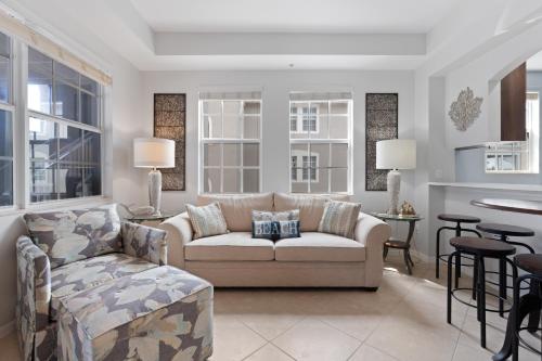 a living room with a couch and a table at White Cap Condo B201 by Sun Palace Vacations in Fort Myers Beach