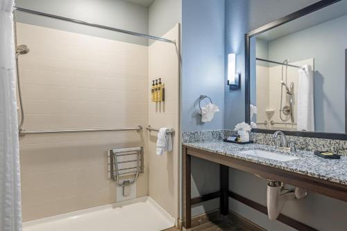 a bathroom with a sink and a shower at Best Western Plus Overland Inn in Fort Morgan
