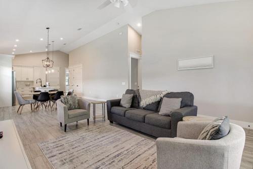 a living room with a couch and a dining room at Friendly City Fun in Bradenton