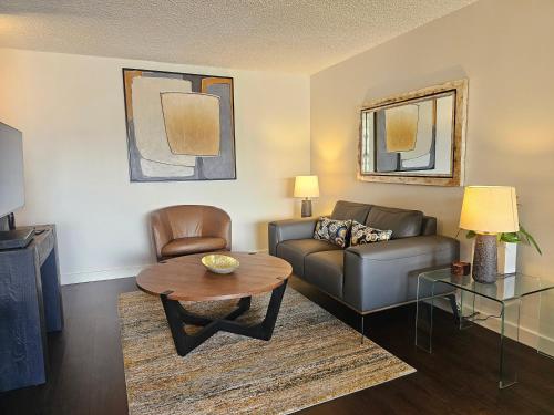 a living room with a couch and a table at Discovery Bay 3517 in Honolulu