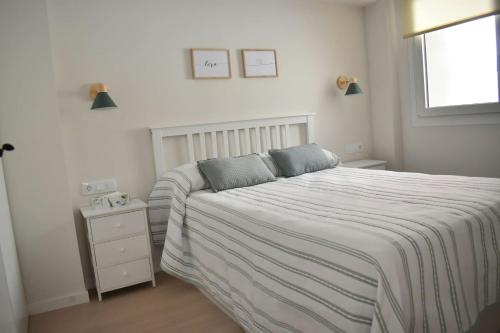 a bedroom with a large bed and a window at Casa El Abuelo in Bronchales