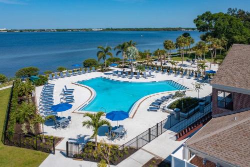 an aerial view of a resort pool with chairs and umbrellas at Carlton Arms View B1 # A in Bradenton
