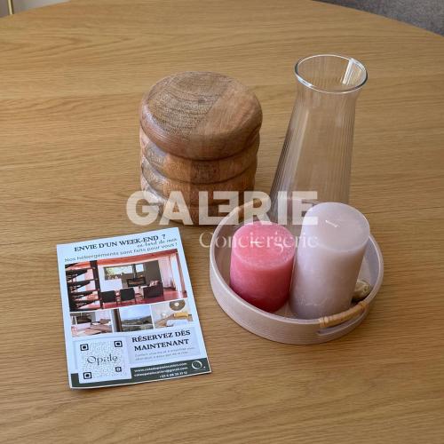 a table with a container of cosmetics and a magazine at GC - Les Flots in Wissant