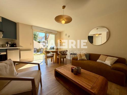a living room with a couch and a table at GC - Les Flots in Wissant