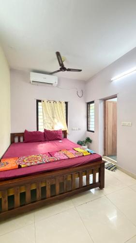 a bedroom with a large bed in a room at Gravity Groups Core - Pannai veedu in Puducherry Airpoert