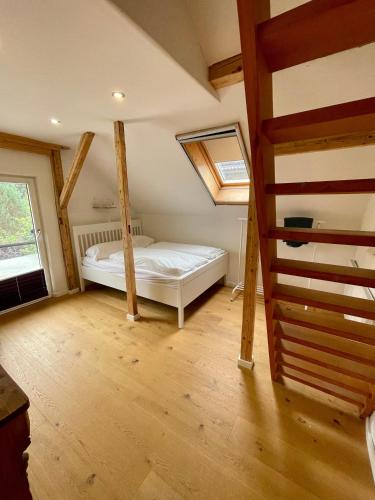 a bedroom with a bed in a attic at Kaiserblick Lodge Oberaudorf in Oberaudorf