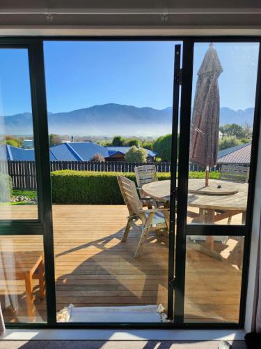 a view of a patio from a sliding glass door at Handy to Town, Spacious, Relaxed - KK14905 in Kaikoura