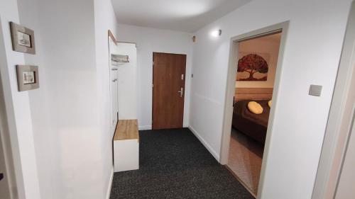 a small room with a bed and a mirror at Przy Głównej in Zamość