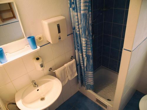 a bathroom with a shower and a toilet and a sink at Zelená chalúpka in Spišská Nová Ves