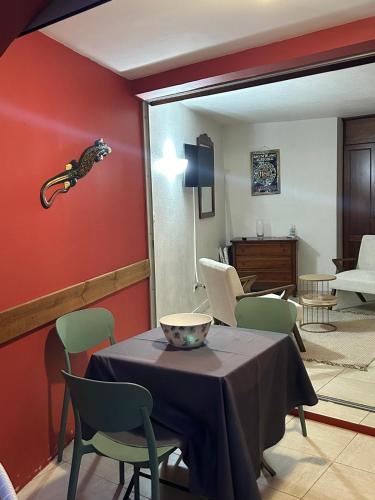 a dining room with a table and chairs at studio Sainte Anne 2mn a pieds de la plage in Sainte-Anne