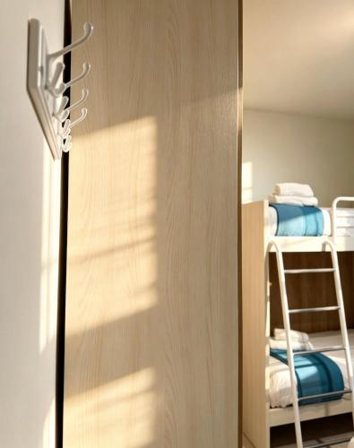 a door leading into a bedroom with a bunk bed at Casa Lanterna - Sottomarina in Chioggia
