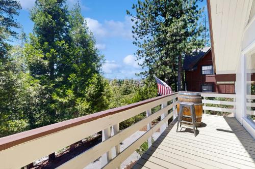 a balcony with an american flag and an american flag at The Fairway Chalet in Lake Arrowhead