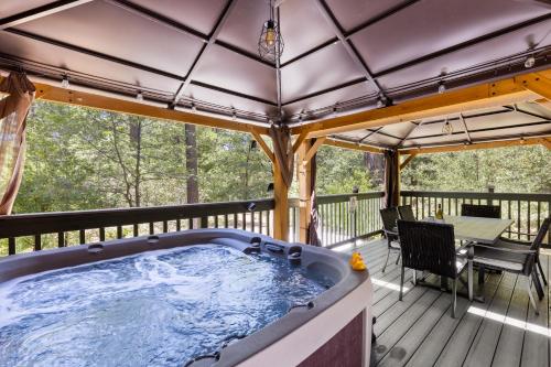 a hot tub on the deck of a house at Peaceful Cabin in Idyllwild