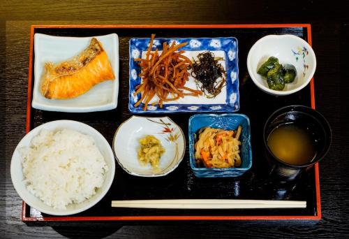 a tray with plates of food on a table at Shibuonsen YAMAICHIYA in Yamanouchi