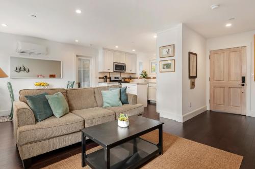 a living room with a couch and a table at California Comfort in Santa Barbara