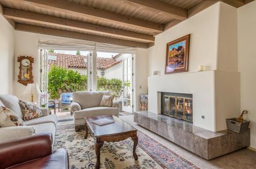 a living room with a fireplace at Garden Escape in Santa Barbara