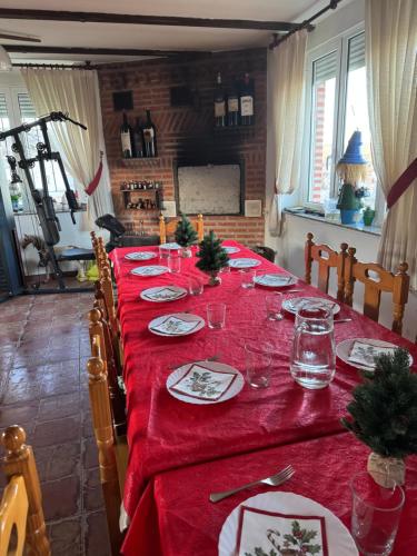 a long table with a red tablecloth on it at Eclipse 2026 in Tamarón