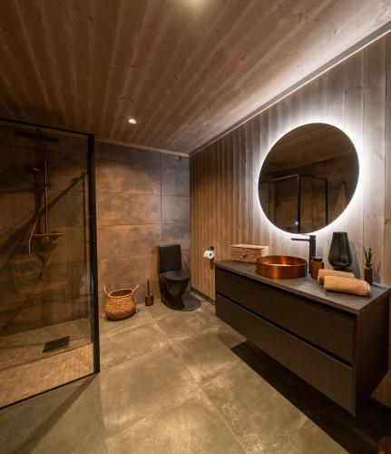 a bathroom with a sink and a mirror at Hylja Lodge in Vaga