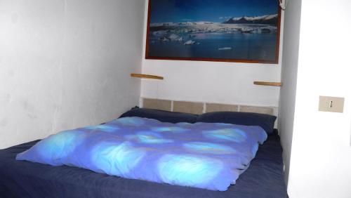מיטה או מיטות בחדר ב-Barcola Holidays Casa Vacanze