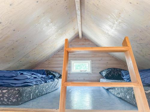 a room with two bunk beds and a window at Bumble bee in Ellemeet