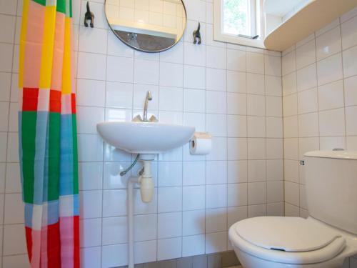 a bathroom with a sink and a toilet at Sandy Seven in Ellemeet