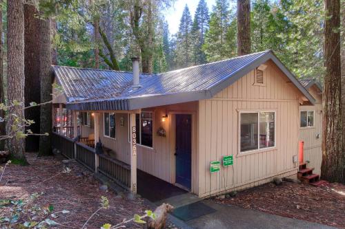 a tiny house in the middle of a forest at Hibernation Hideaway- Inside Yosemite- Dog Friendly in South Wawona