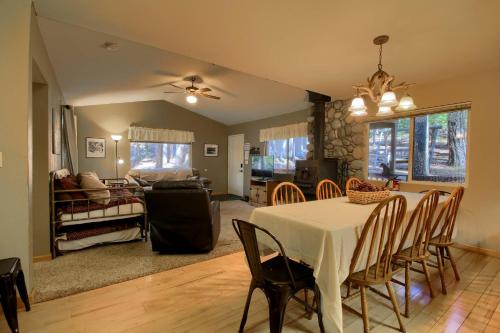 a dining room and living room with a table and chairs at Hibernation Hideaway- Inside Yosemite- Dog Friendly in South Wawona