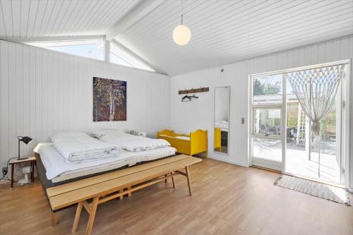 a bedroom with a bed and a large window at SL364-Slagelse-Hirsevangen-4 in Strandlyst