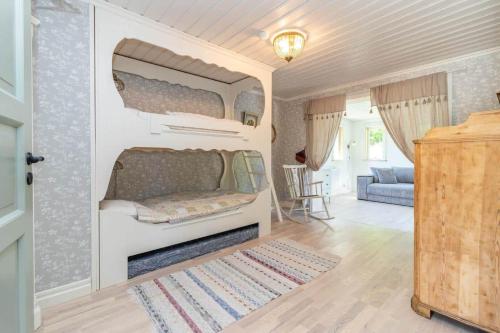 a room with a bunk bed and a living room at VMA812-Kolsva-Lomstigen-7 in Kolsva