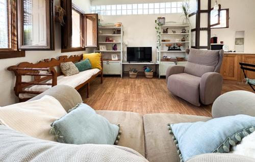 a living room with two couches and a tv at Lovely Home In Abarán in Abarán