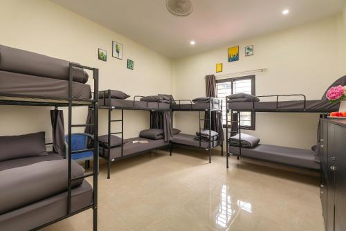 a room with a bunch of bunk beds at Queen Cafe Hostel in Hanoi