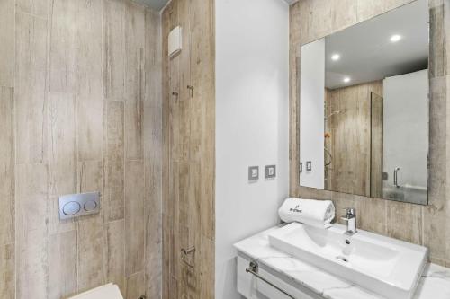 a bathroom with a sink and a mirror at Fouka Bay Holiday Apartments By BlueKeys in Marsa Matruh