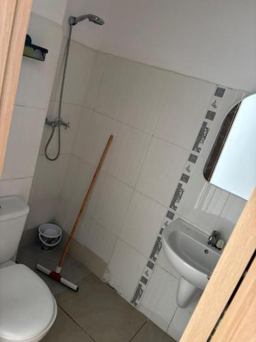 a bathroom with a shower and a toilet and a sink at Appartement entier 1min de la plage sable d'or in Tangier