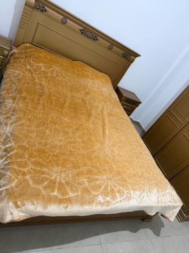 a large bed in a room with at Appartement entier 1min de la plage sable d'or in Tangier