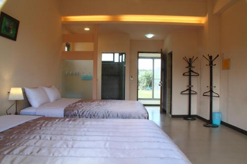 Cama o camas de una habitación en Kuan Min B&B