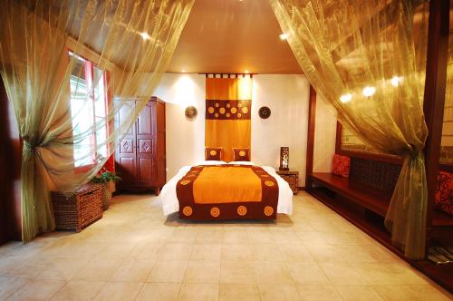 Postel nebo postele na pokoji v ubytování March 3 B&B Yilan