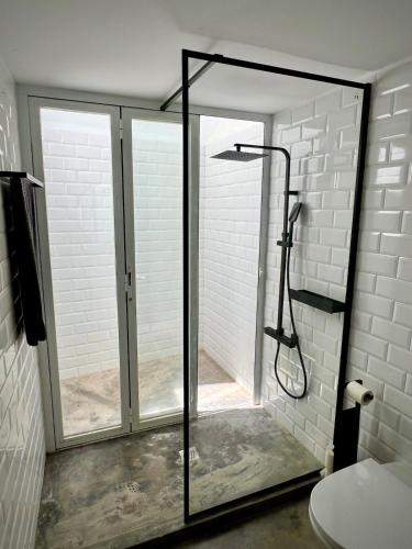 a shower with a glass door in a bathroom at Villa Nooma Elvas in Elvas