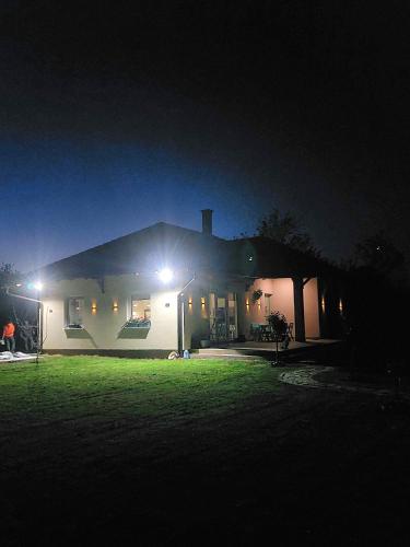 a house lit up at night with lights at 3a kuca Bajevac in Bajevac