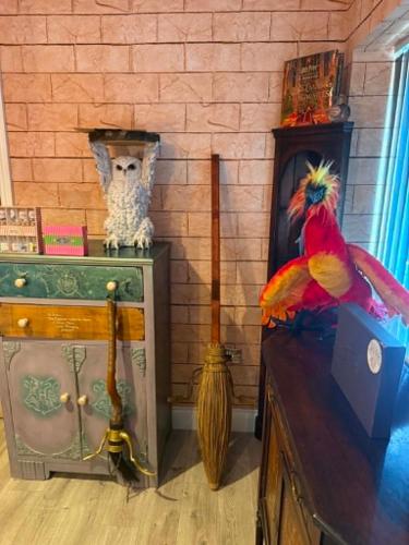 a room with a parrot sitting on a dresser at Harry Potter feature room- Warner bros studios in Watford