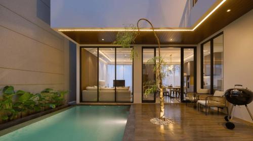 a house with a swimming pool in a living room at Alcola Boutique Villa - Dania Unit in Tlekung
