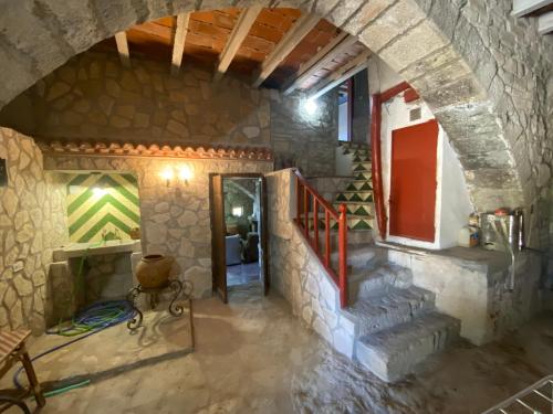 a hallway of a house with a stone wall at Cal Rabell in Bellmunt