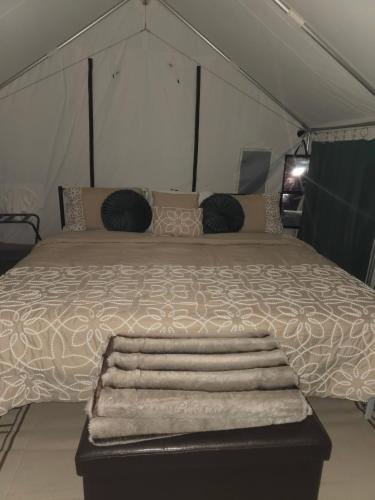a bedroom with a large bed in a tent at Starlit Jasmine in Christiansted