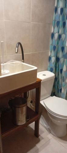a bathroom with a sink and a toilet at Casa en Marindia Sur in Salinas