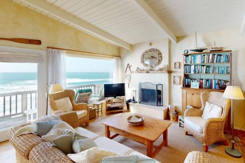 a living room with a view of the ocean at Oceanfront Dream in Cayucos