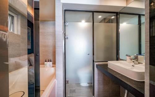 a bathroom with a shower and a sink at Busan Gwangalli SEAYOU HOTEL in Busan