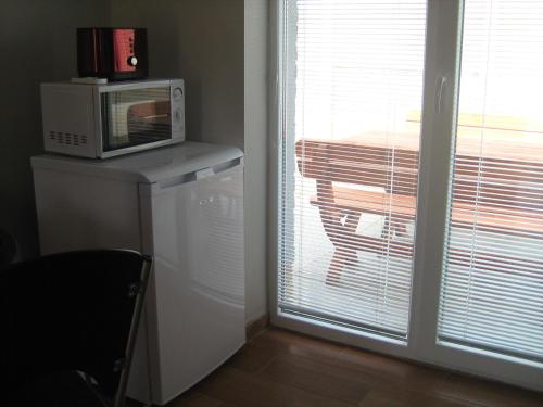 A kitchen or kitchenette at Viktória&Krisztián Apartments