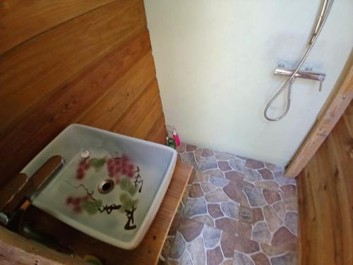 a sink with flowers on it in a bathroom at Island Breeze in Negril