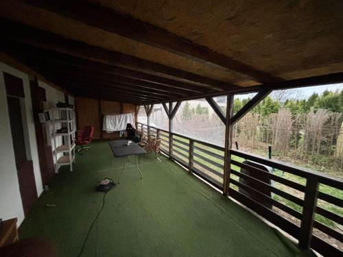 a person sitting in a room with a view of a river at Fele&Ami house in Bontida