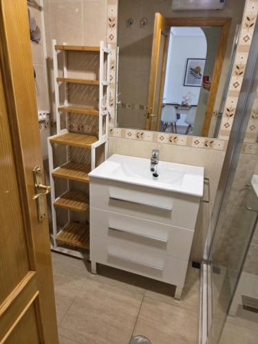 a bathroom with a sink and a mirror at Mar de Cristal in Mar de Cristal