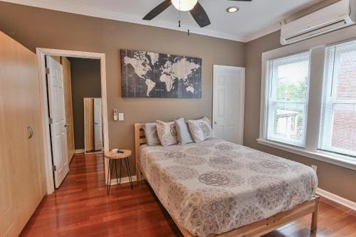 a bedroom with a bed and a window at BurgBnB Riverfront in Harrisburg